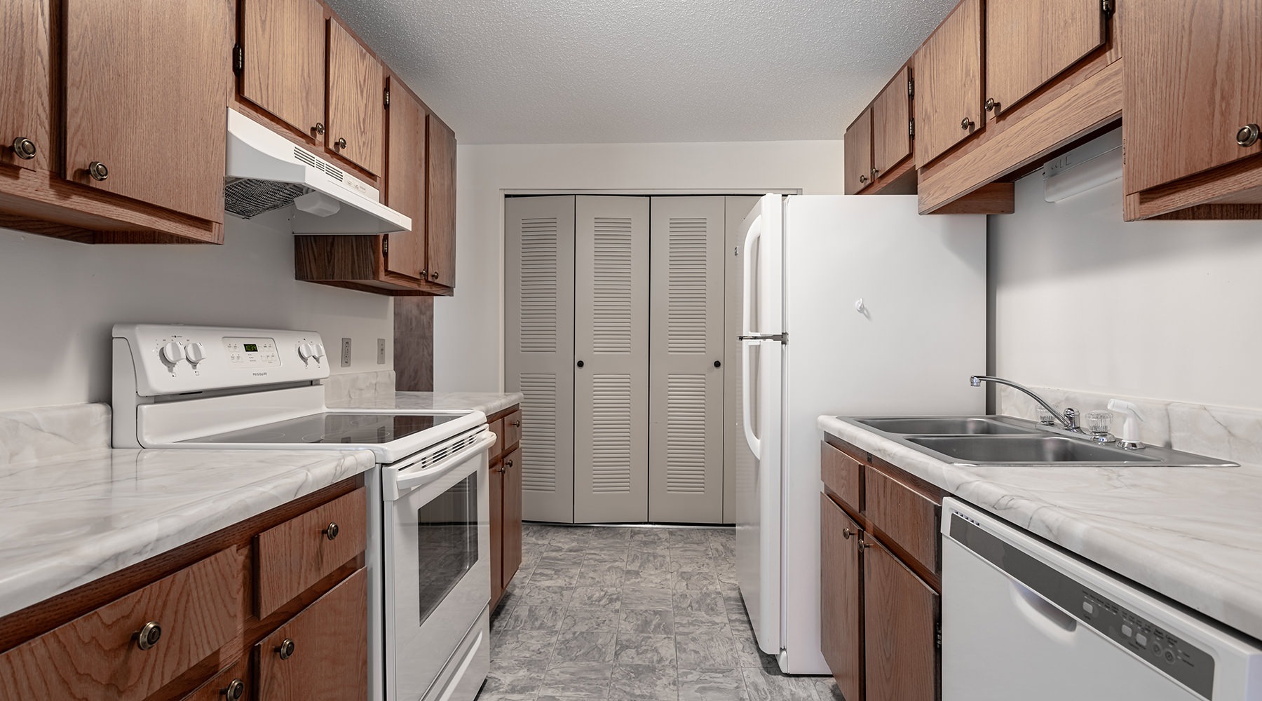 Kitchen large kitchen with ample lighting and pantry in background